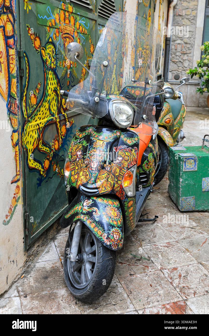 Ornately painted motorbike or motor scooter, Taormina, Sicily, Italy, Europe Stock Photo