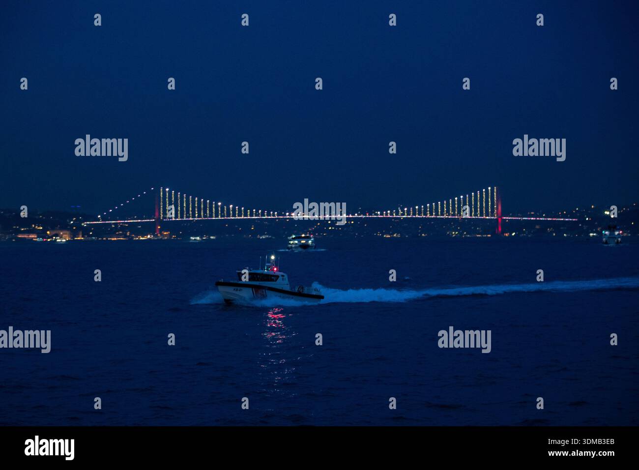 A coast guard boat seen sailing in the Bosphorus during the evening ...