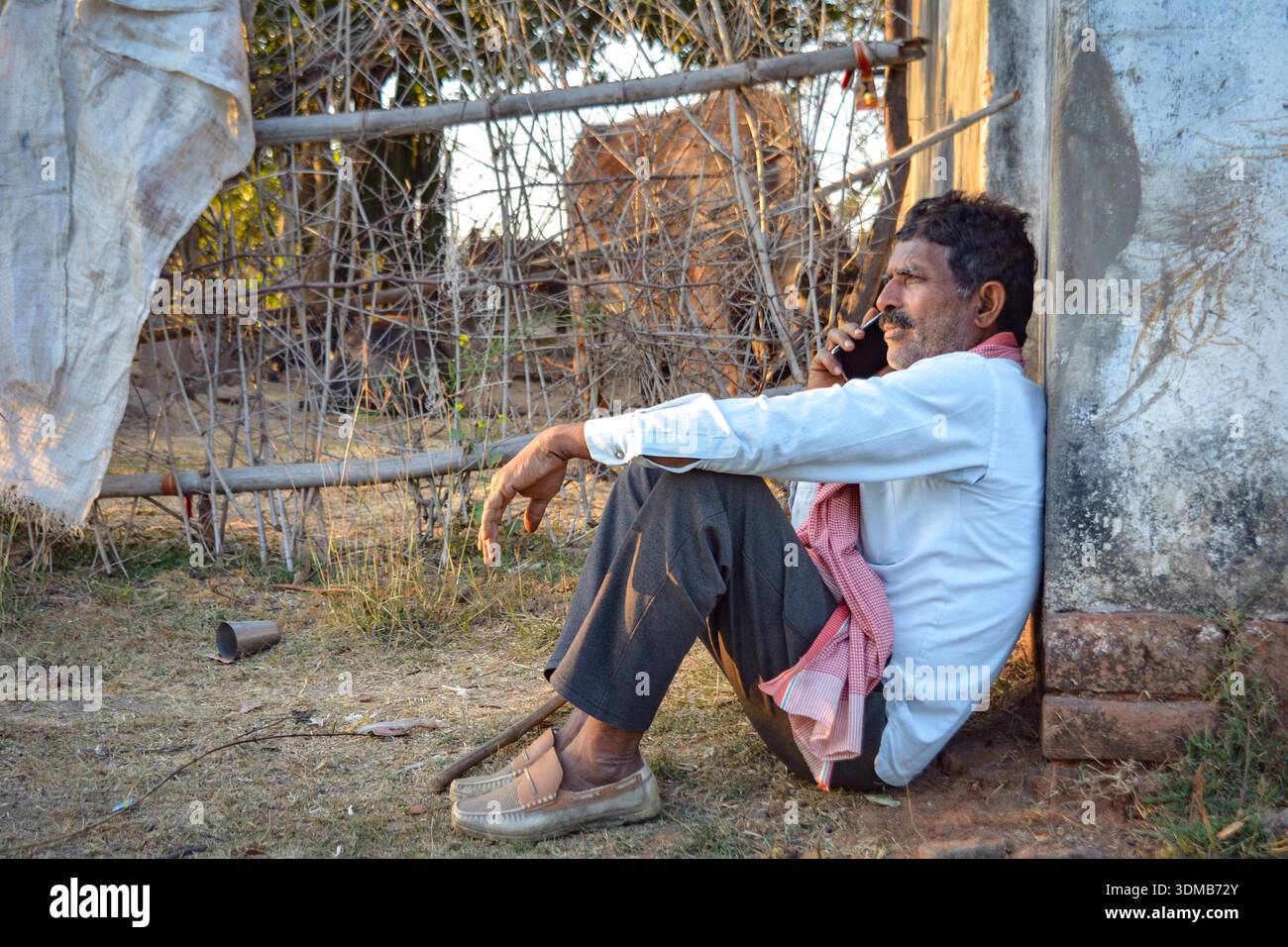 Rural indian farmer talking on mobile phone Stock Photo