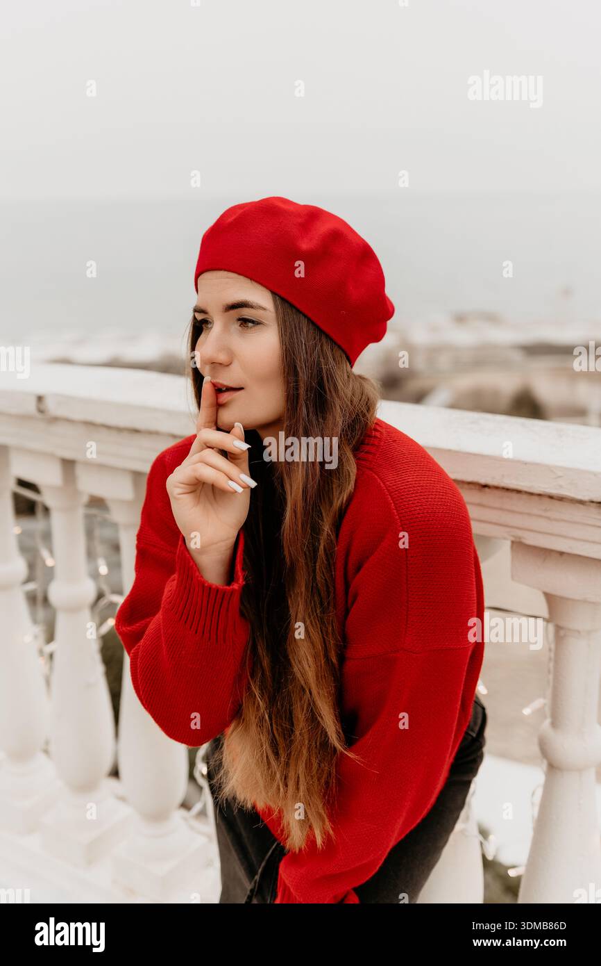 Woman beret shushing silence hi-res stock photography and images - Alamy