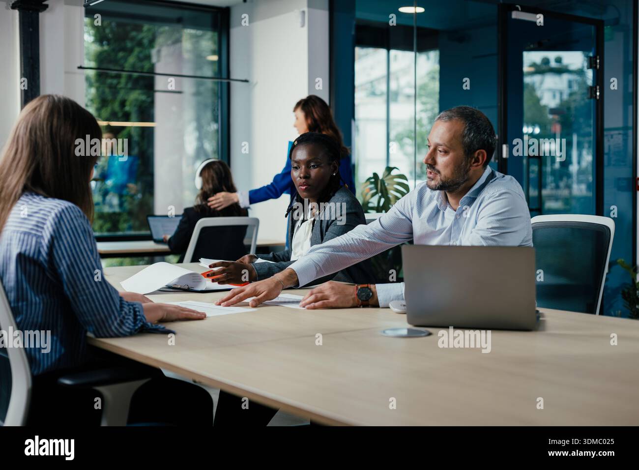 Diverse business team collaborating during an office meeting Stock Photo
