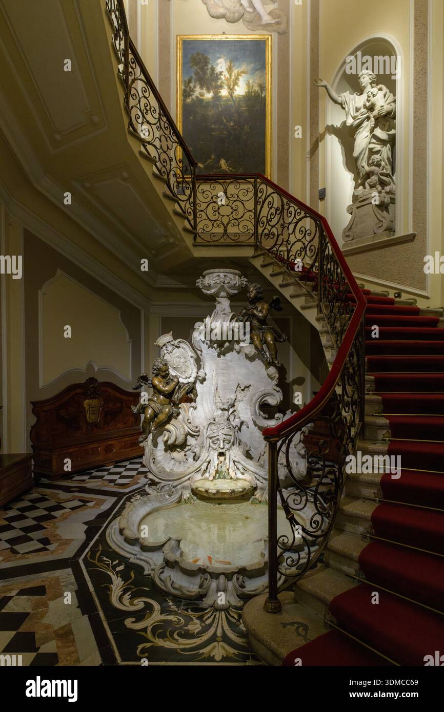Staircase with fountain in Museo Poldi Pezzoli, Milan, Italy. Interior by Giuseppe Balzaretto, Neo-Renaissance style (Scalone d'onore). Stock Photo