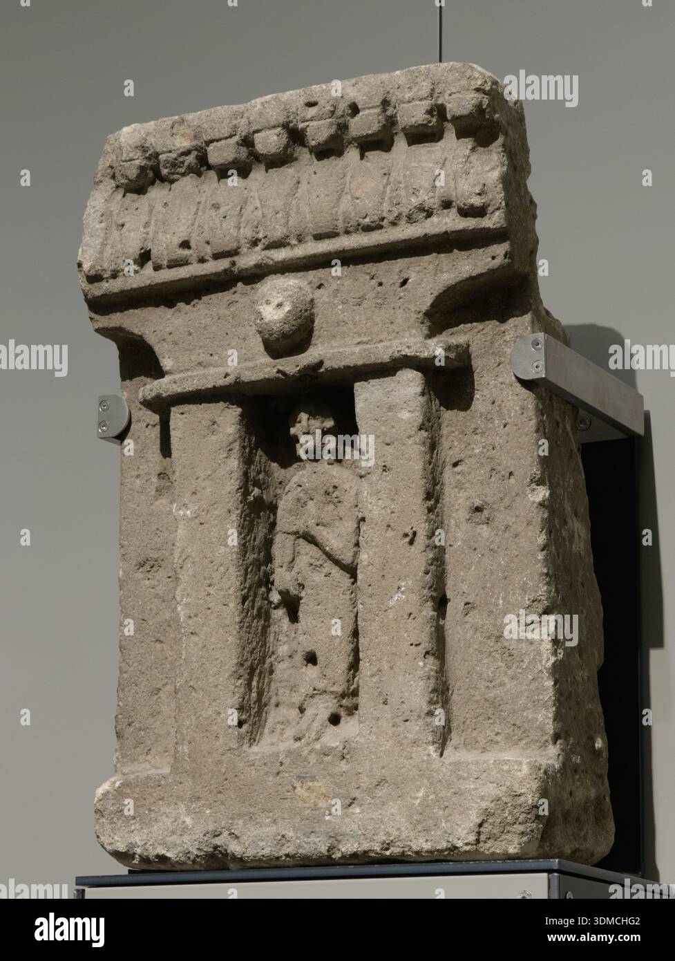 Punic votive stele with female figure holding a flower, 6th-5th century BC, at Musei Reali di Torino, Turin, Italy. Stock Photo