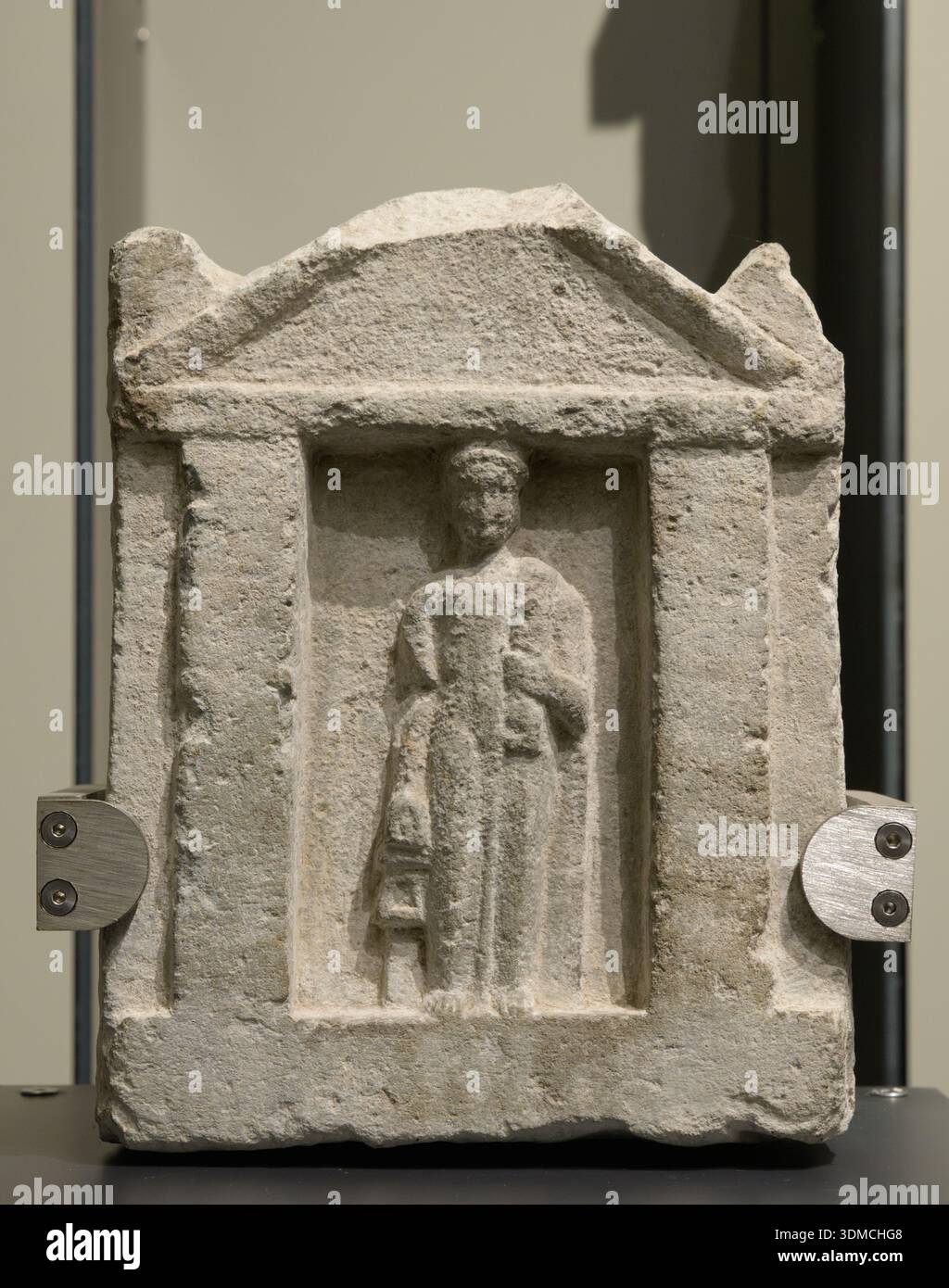 Punic votive stele with a figure wearing a stole, 4th-3rd century BC, at Musei Reali di Torino, Turin, Italy. Stock Photo