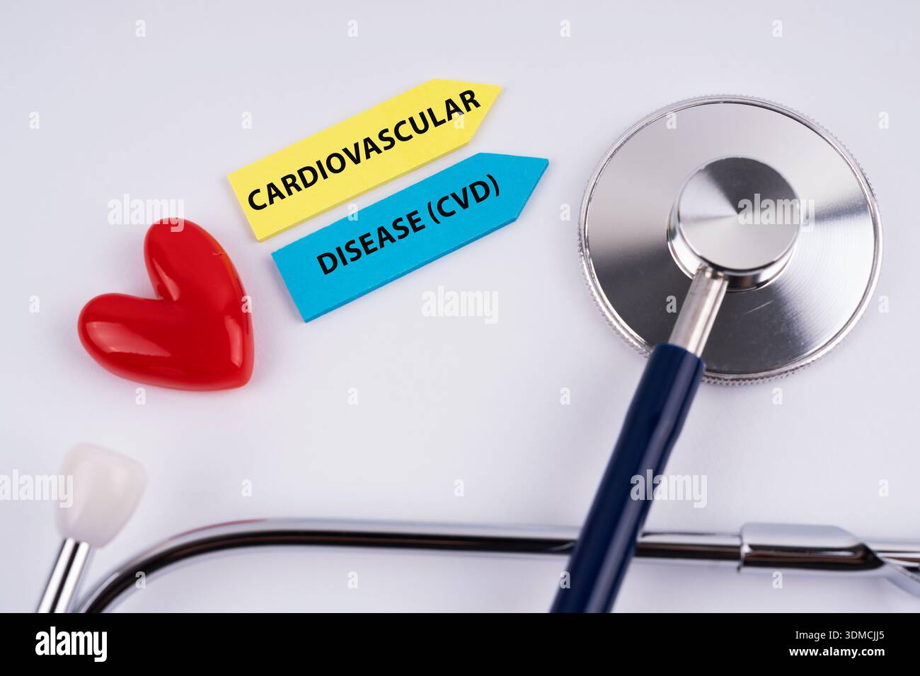 Cardiovascular disease - CVD text with stethoscope and heart shape Stock Photo
