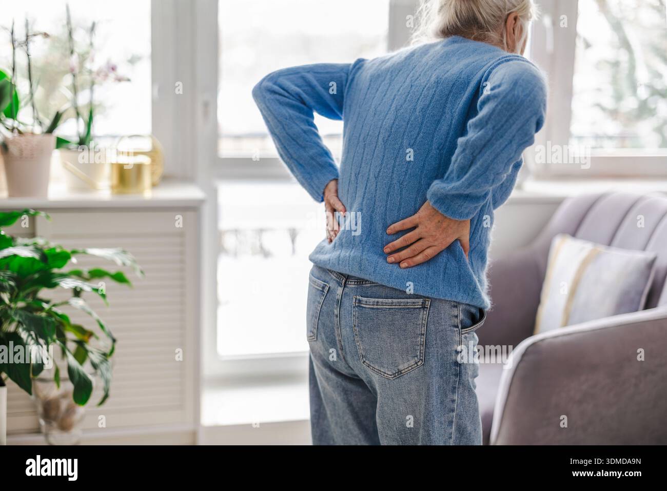 Senior woman suffering from back pain Stock Photo