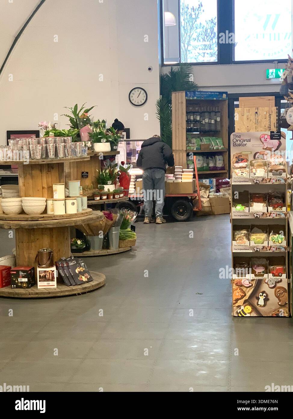 Farm shop called Whites Earls Barton Northamptonshire England British English customers browsing fresh products displayed on shelves of local goods - Smartphone Captured Stock Image