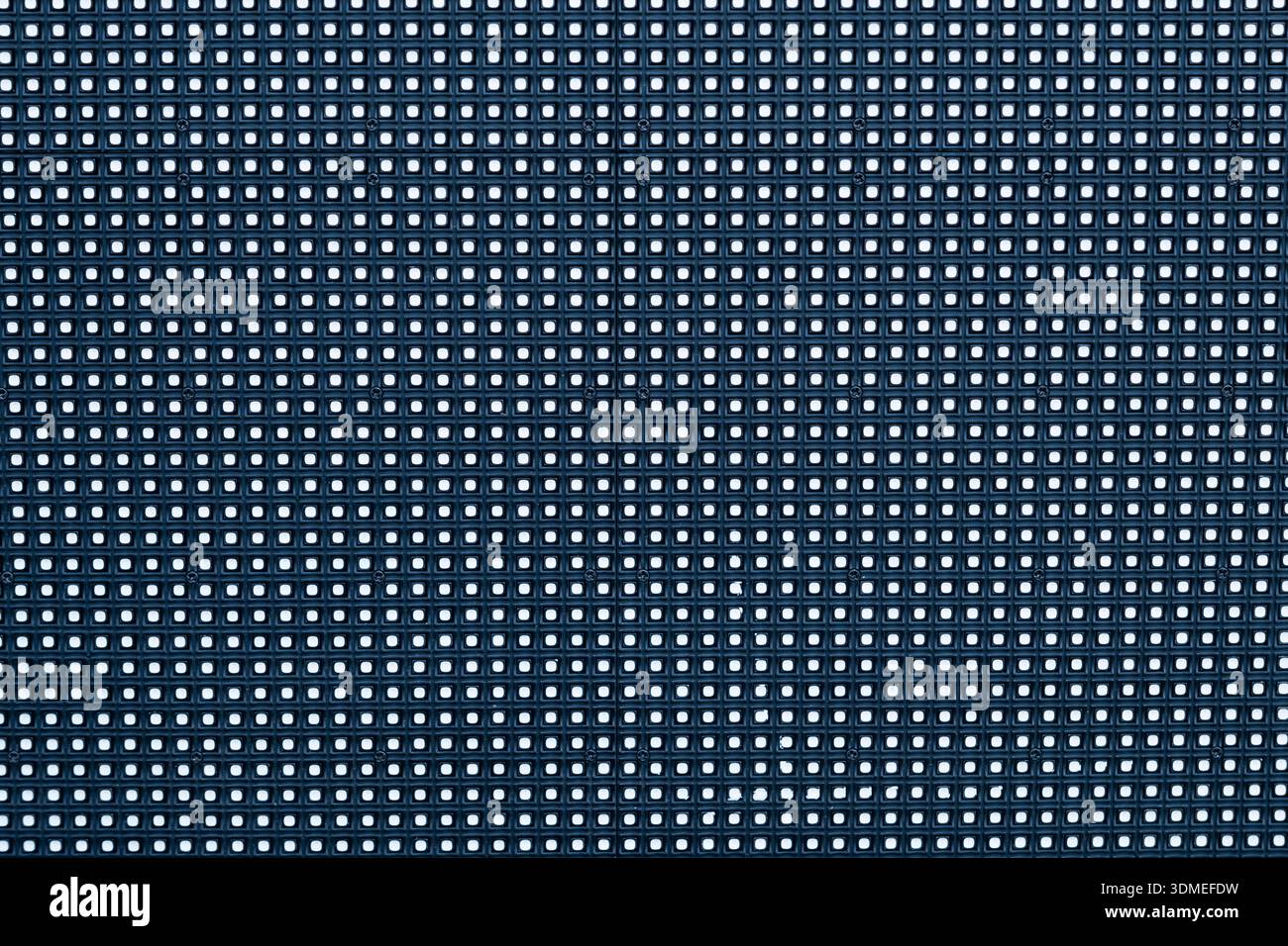 LED screen close-up with bright pixels, symbolizing digital technology Stock Photo