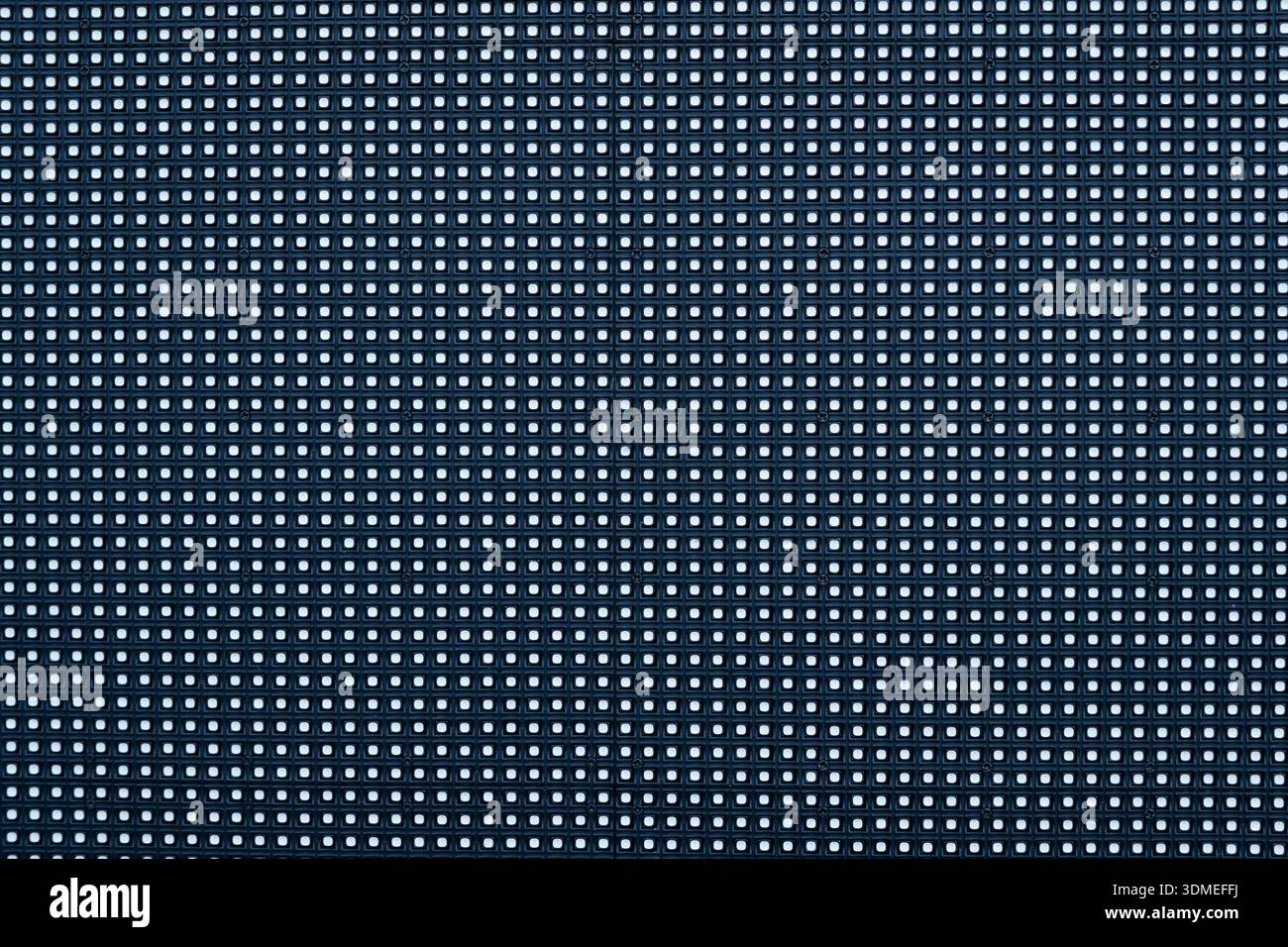 LED screen close-up with bright pixels, symbolizing digital technology Stock Photo