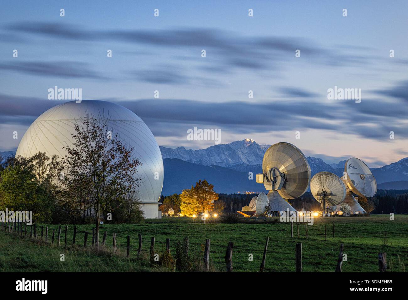 Raisting earth station and Zugspitze at dusk. Raisting, Bavaria, Germany. Stock Photo