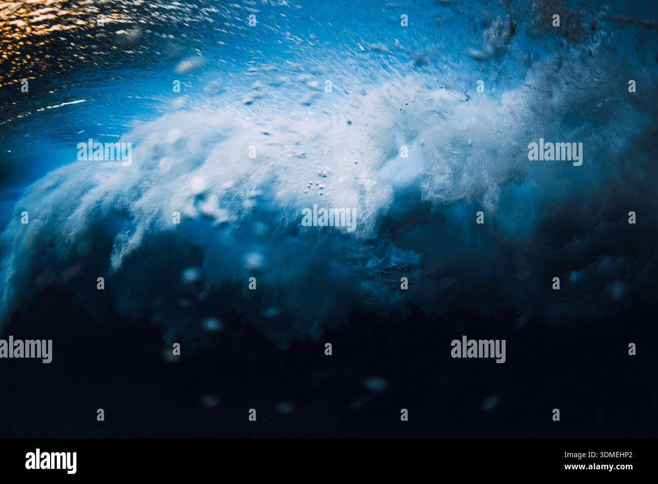 Powerful ocean wave underwater with bubbles and motion, abstract sea energy and natural water texture Stock Photo