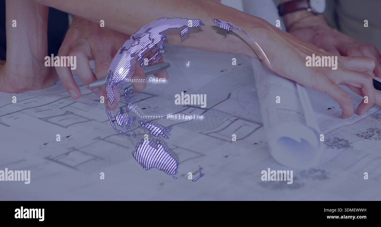 Pointing two hands in rolled sleeves tracing plans on studio table, with rolled plan, digital globe Stock Photo