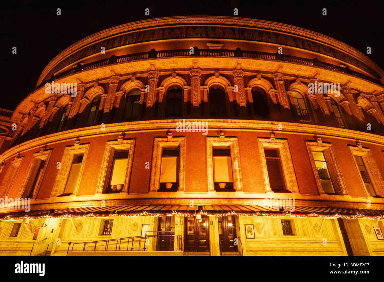 England, London, Westminster, Kensington and Chelsea, Knightsbridge, Exterior View of Royal Albert Hall Illuminated at Night Stock Photo