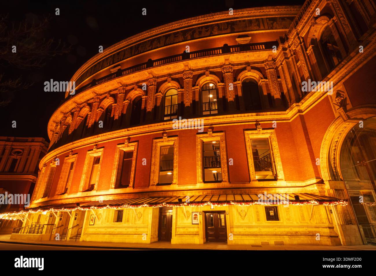 England, London, Westminster, Kensington and Chelsea, Knightsbridge, Exterior View of Royal Albert Hall Illuminated at Night Stock Photo