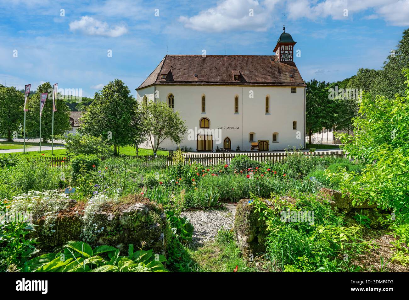 Gomadingen - Offenhausern, monastery garden and former monastery church of Offenhausen Monastery. The church now houses the stud farm museum. Stock Photo