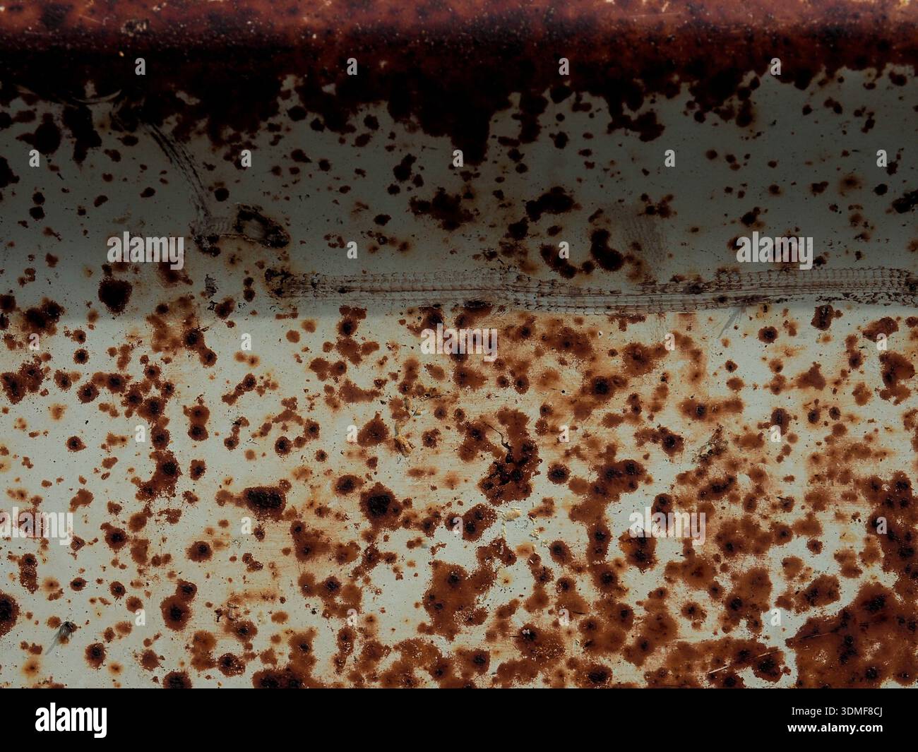 Rusty surface with exfoliated paint in gray using as background Stock Photo