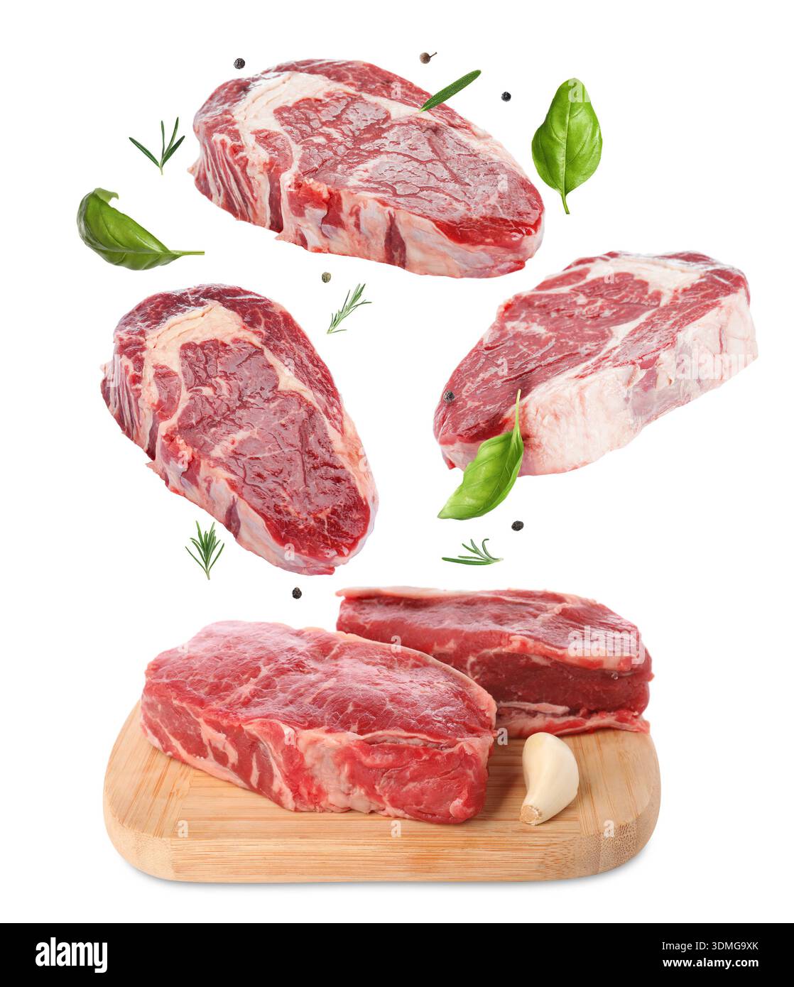 Fresh beef steaks falling on white background Stock Photo