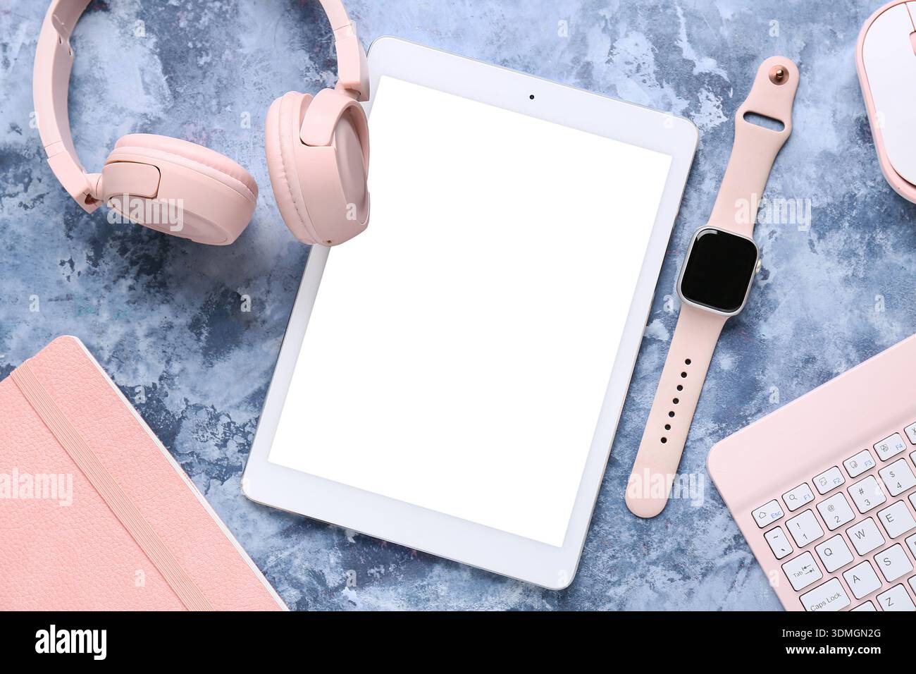 Composition with different modern gadgets and notebook on blue grunge background, closeup Stock Photo