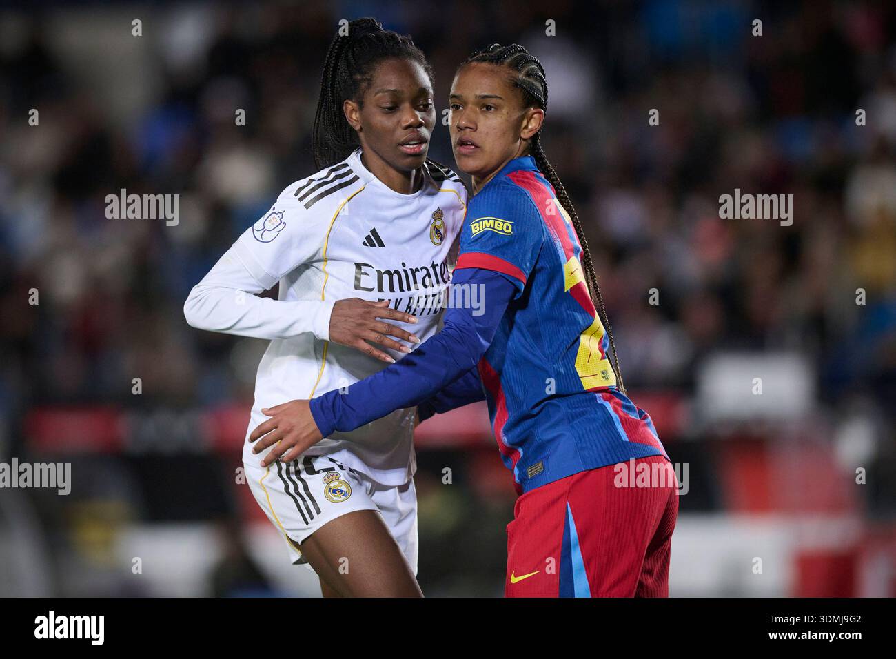 Real Madrid CF’s Naomie Feller (L) and FC Barcelona’s Esmee Brugts ...