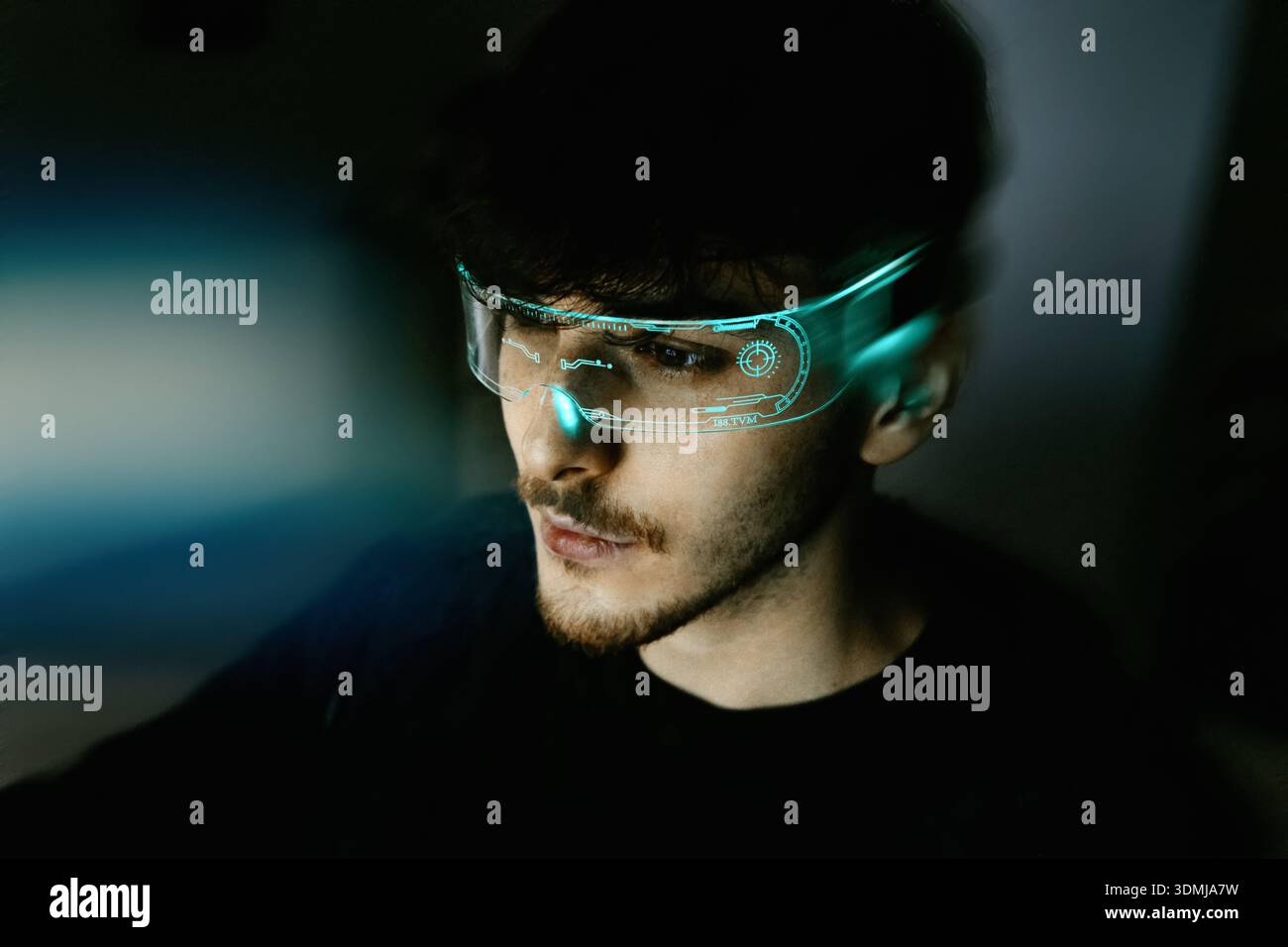 Young man using computer with led cyber augmented reality headset Stock Photo