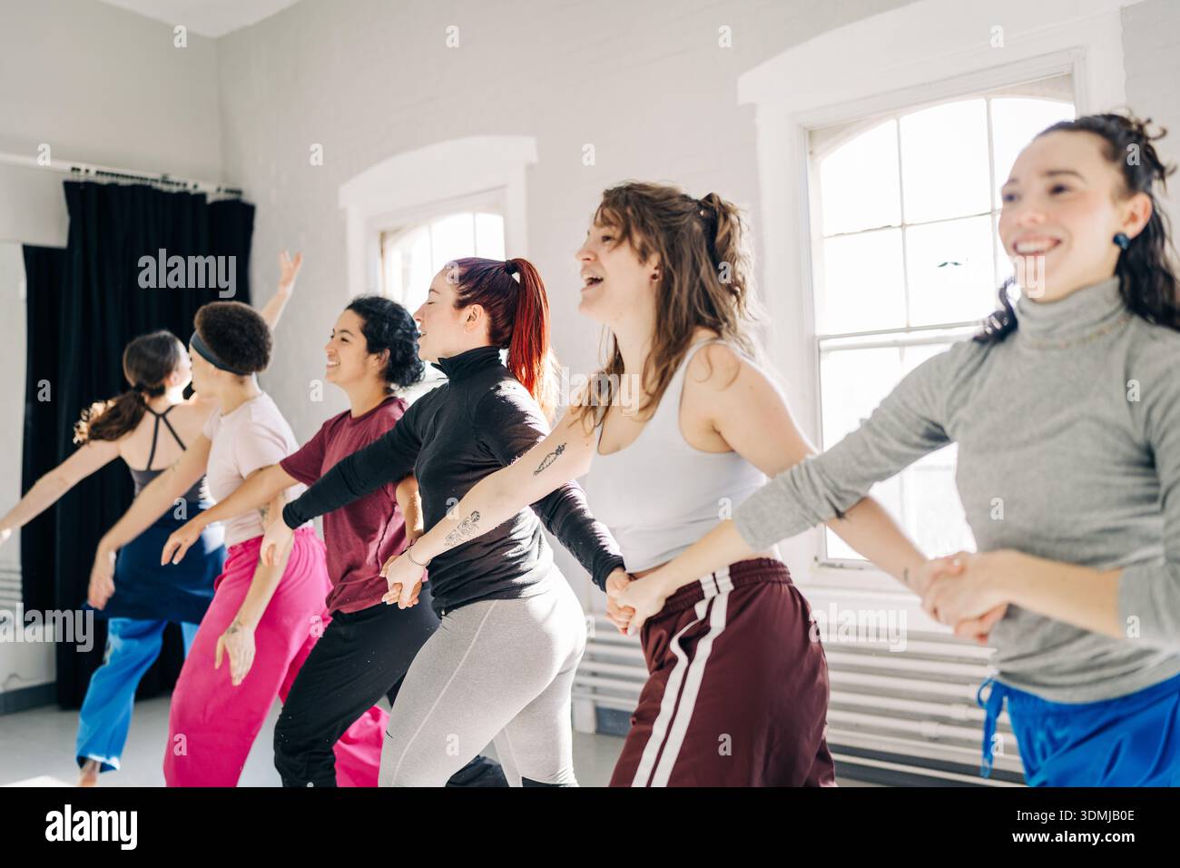 Diverse women dancing together during a studio rehearsal Stock Photo