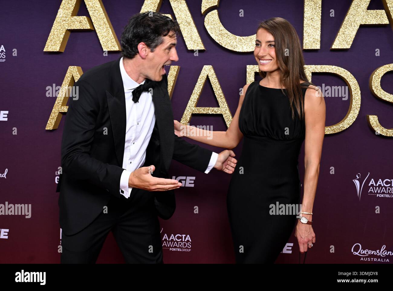 Andy Lee and Rebecca Harding are seen posing for a photo on the red ...