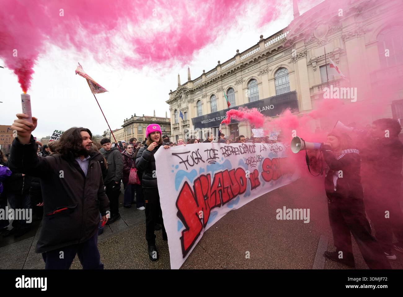 EDS NOTE: OBSCENITY - Protesters walk with a banner during an anti-ICE ...