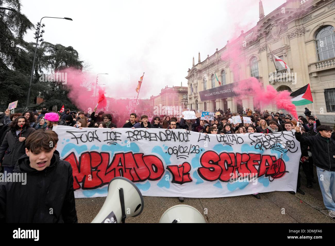 EDS NOTE: OBSCENITY - Protesters walk with a banner during an anti-ICE ...