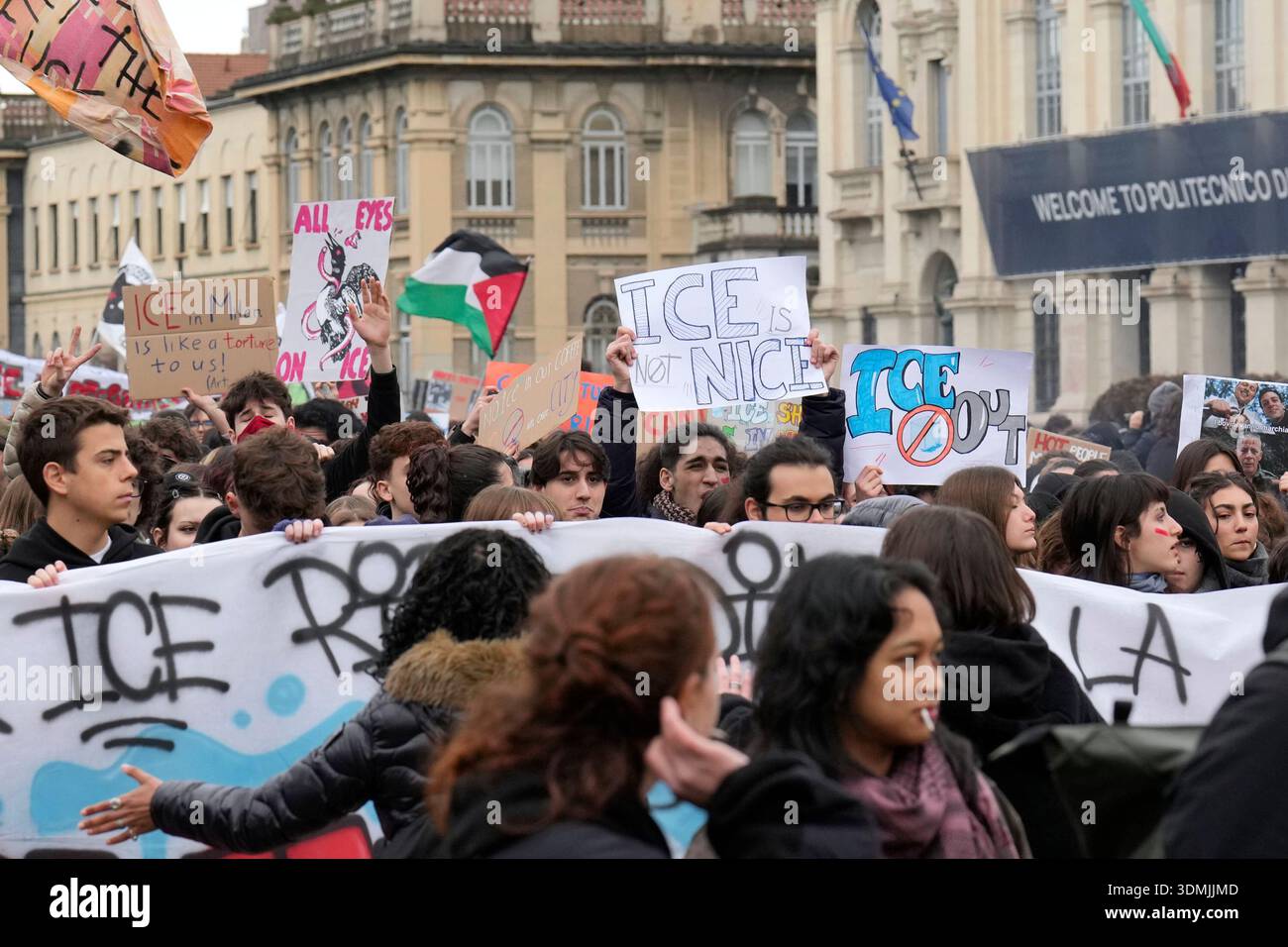 EDS NOTE: OBSCENITY - Protesters walk with signs during a demonstration ...