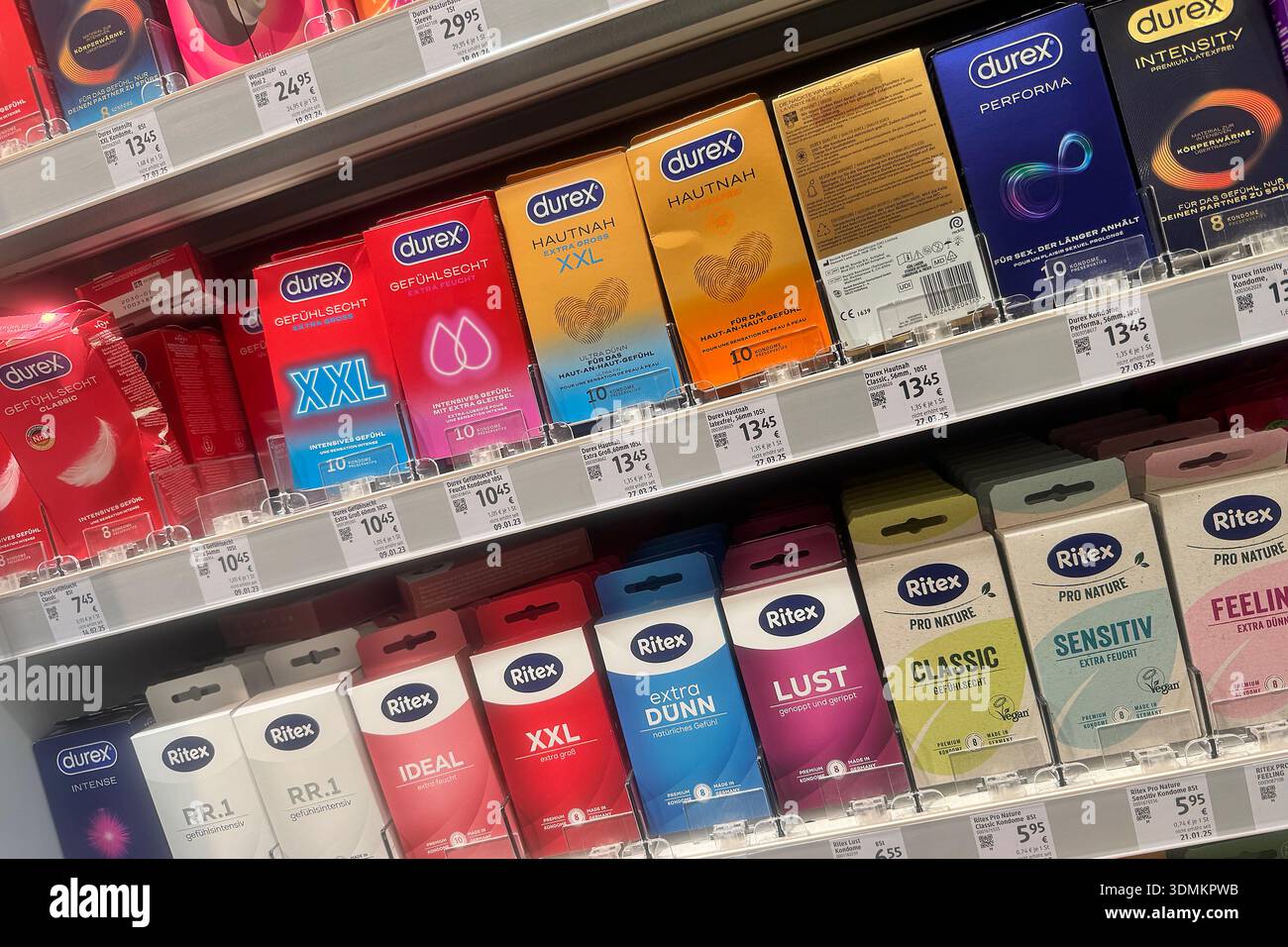 Clear presentation of various condom variants on the shelf, sorted by ...