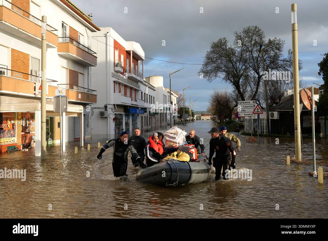 Police officers and marines evacuate residents from a hotel by ...