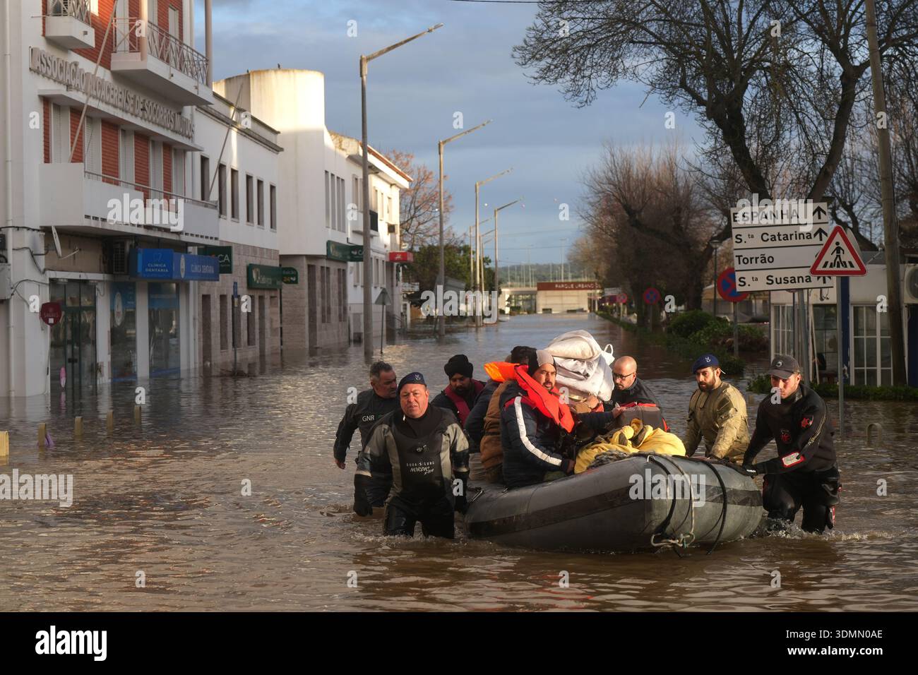 Police officers and marines evacuate residents from a hotel by ...