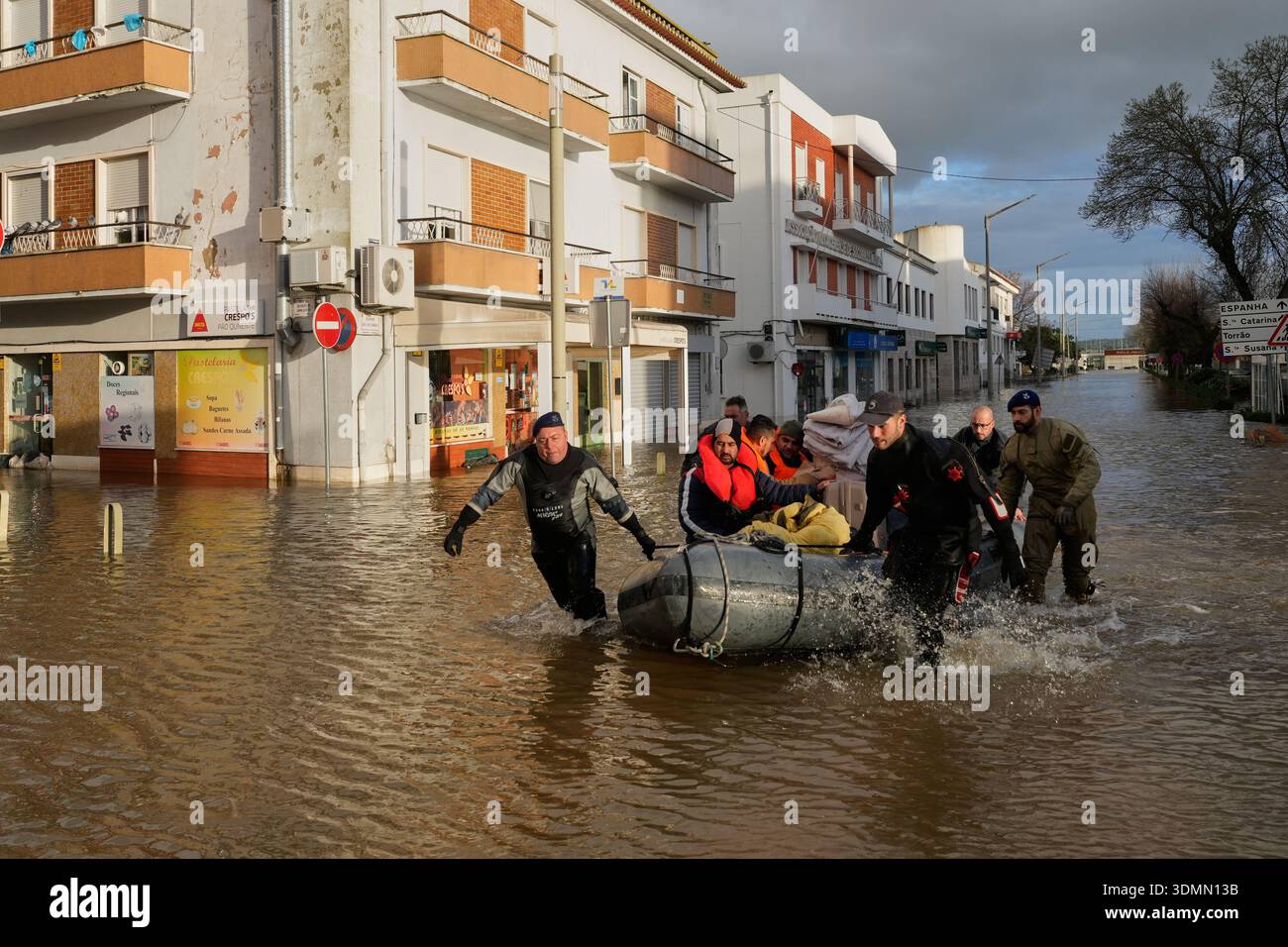 Police officers and marines evacuate residents from a hotel by ...