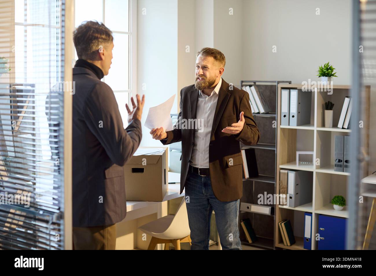 Angry boss confronting employee hi-res stock photography and images - Alamy