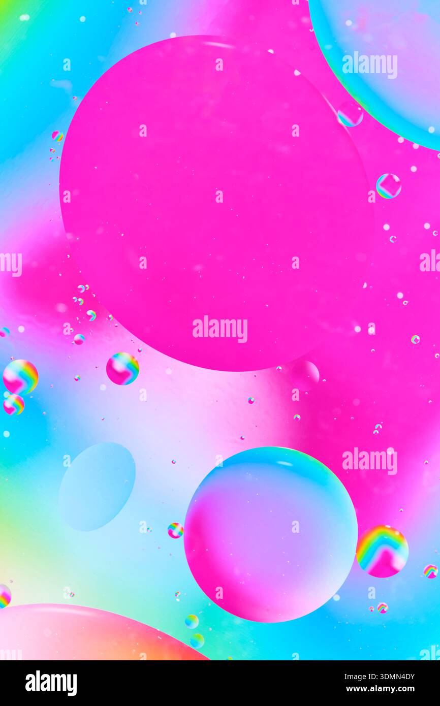Soft abstract pink liquid texture with small white bubbles and subtle light Stock Photo