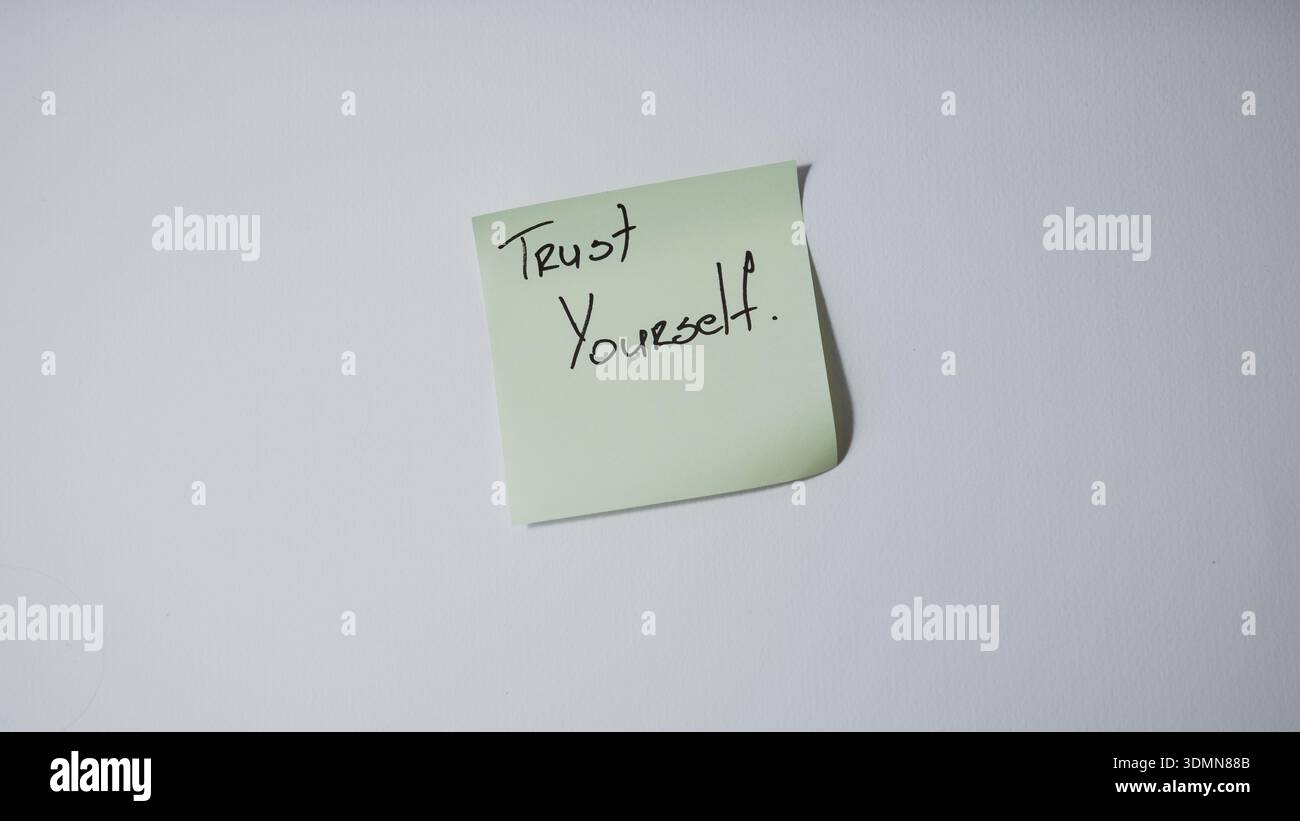 Trust yourself motivational message on sticky note minimal concept background Stock Photo