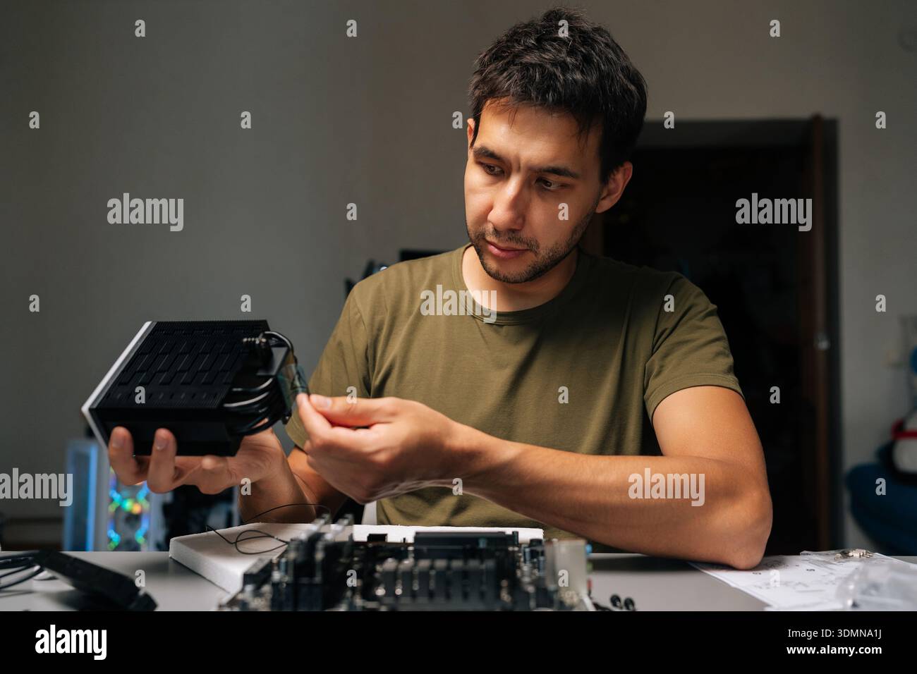 Computer technician installing cpu cooler on motherboard, performing precise desktop computer maintenance and hardware upgrade within professional Stock Photo