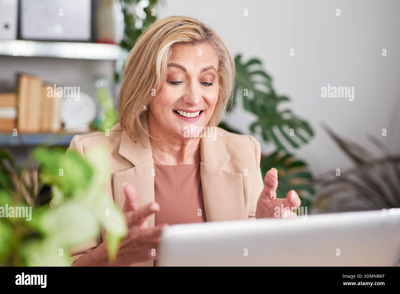 Professional woman in beige blazer hi-res stock photography and images ...
