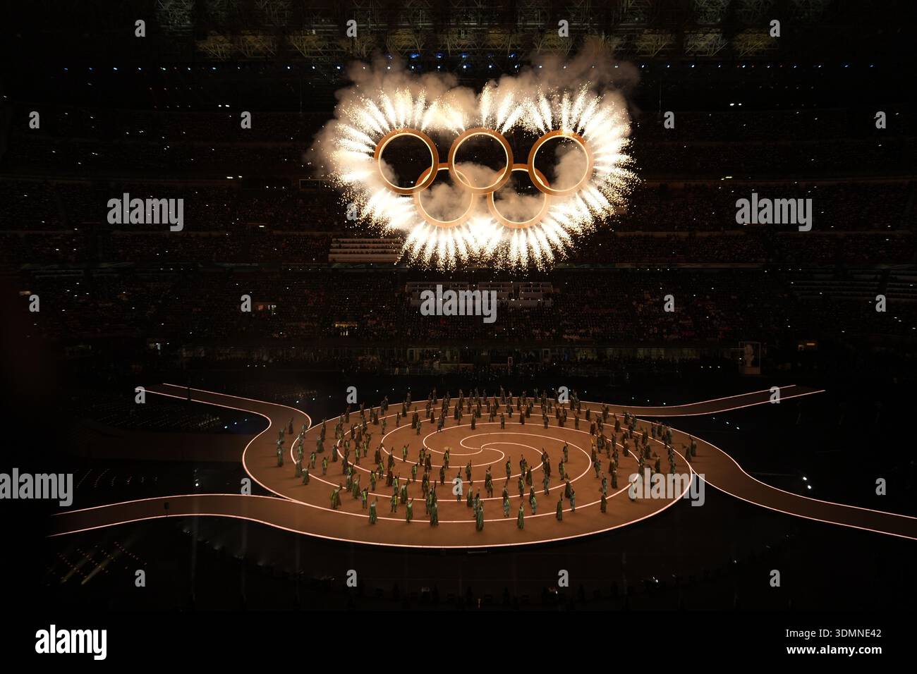 Fireworks explode around the Olympic rings during the Olympic opening ...