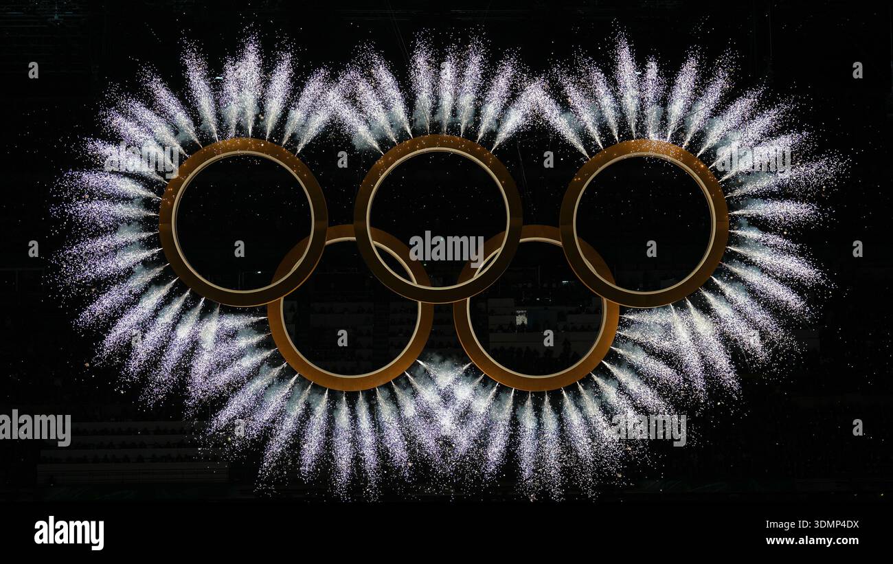 Fireworks explode around the Olympic rings during the Olympic opening ...