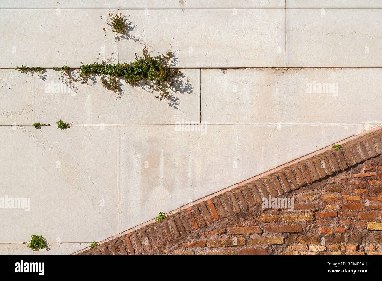 Old white marble and brick wall background Stock Photo