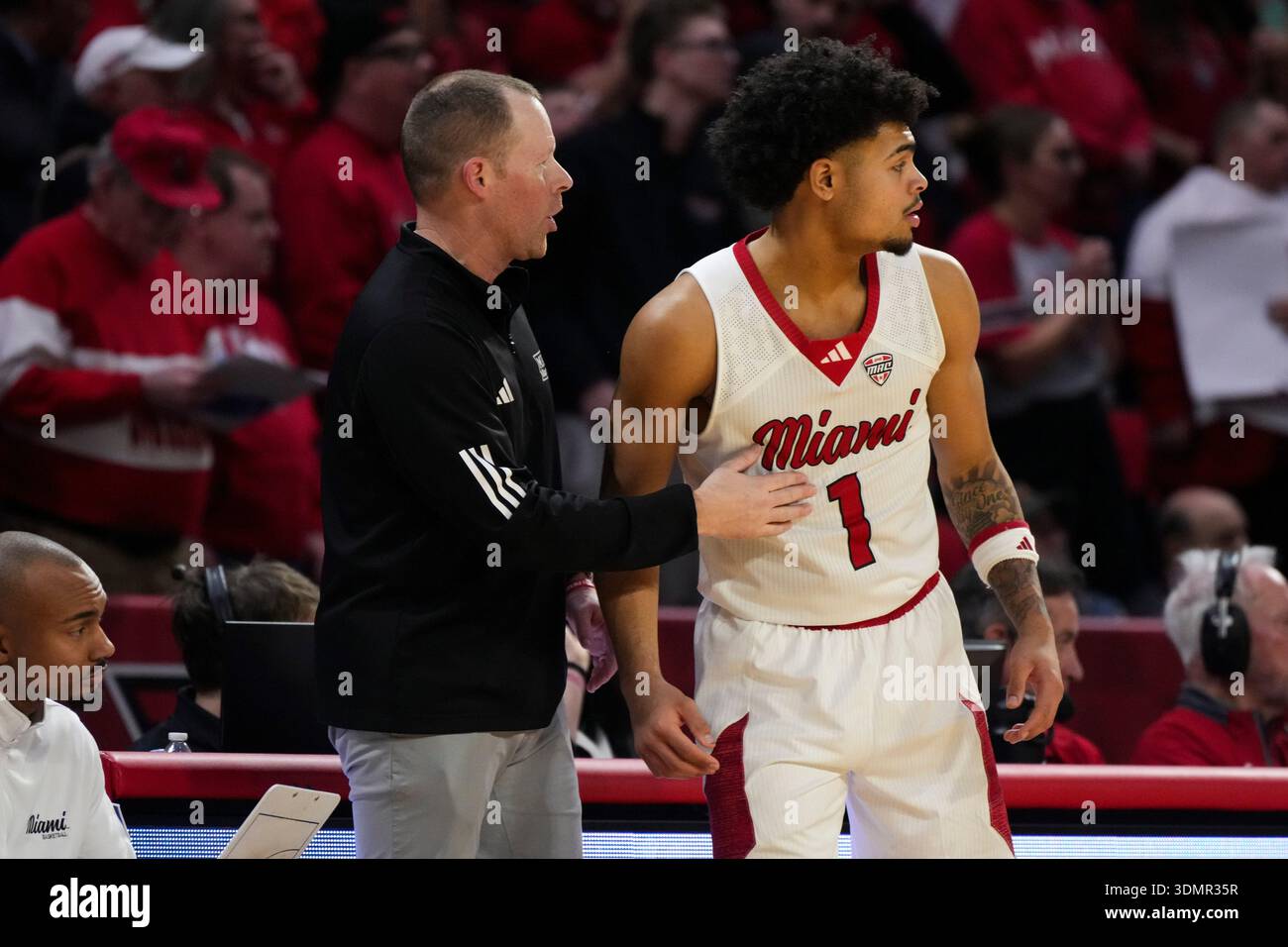 Trey Perry Miami (OH) head coach Travis Steele speaks with Trey Perry (1) during ...