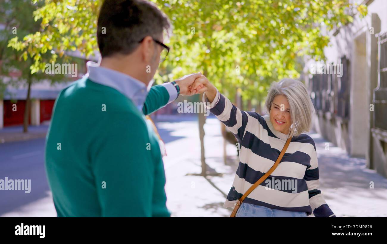 Senior couple dancing and smiling together Stock Photo