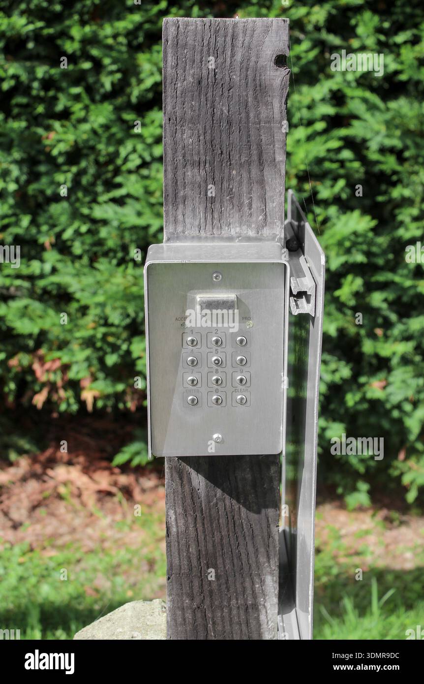 Secure password on keyboard for opening the gate door. Password code Security keypad system protected on private property. The security combination. Stock Photo