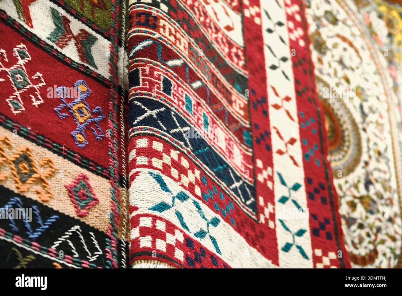 Traditional woven carpets with geometric oriental patterns Stock Photo