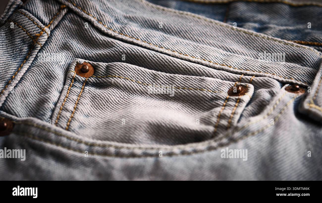 Denim jeans pocket with rivets close-up Stock Photo