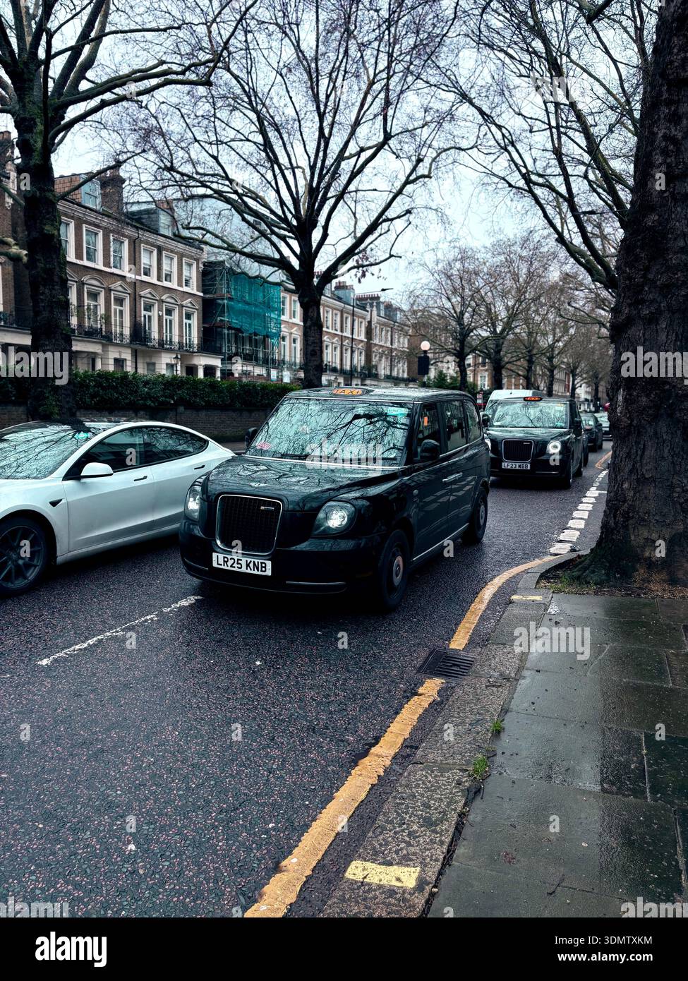 London, UK. 7 February 2026. London black cab taxis queue in slow ...