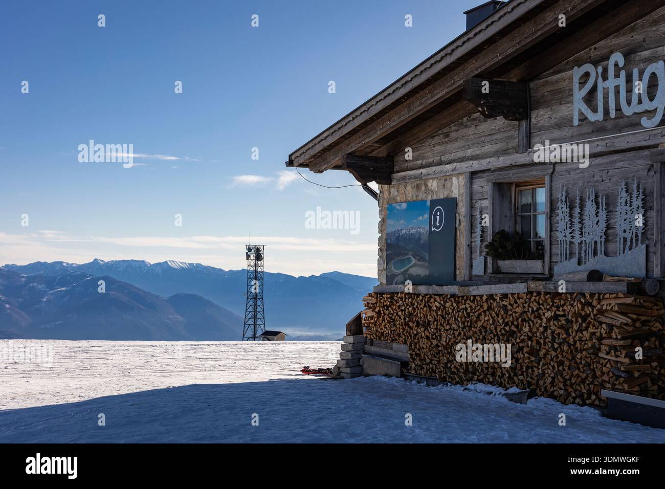Mountain rifugio building on a snowy plateau in the Italian Alps, winter season. Stock Photo