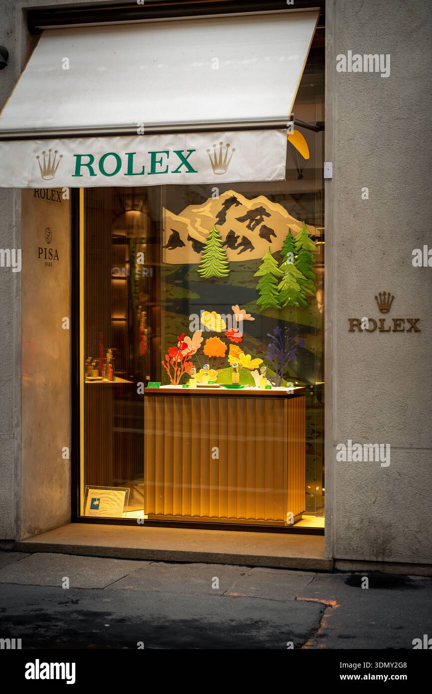 Milan, Italy - 2026, 3 Feb: Rolex FW25 boutique window with elegant mountain-themed display, vibrant colors, and luxury appeal in a stylish urban sett Stock Photo