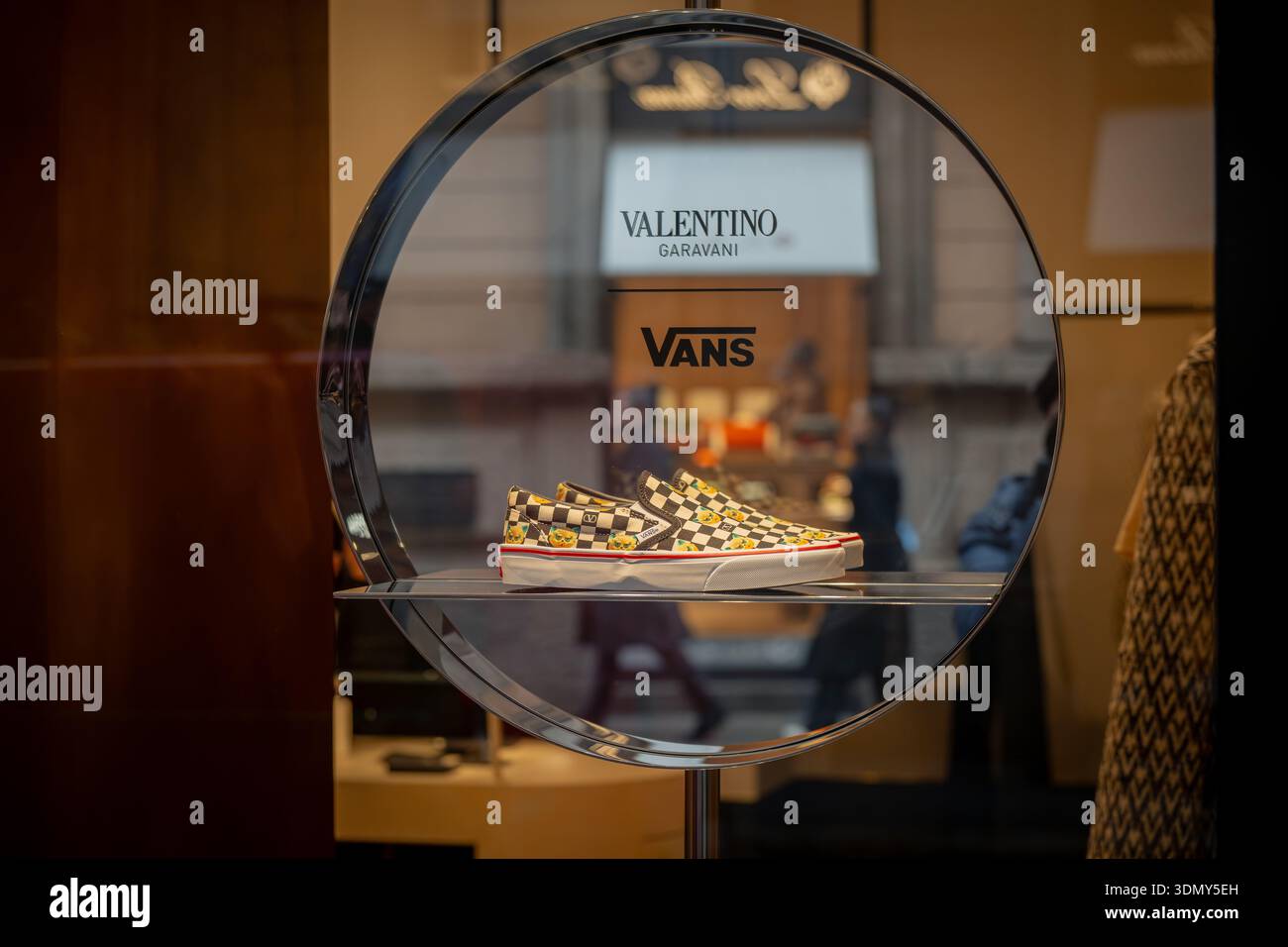 Milan, Italy - 2026, 3 Feb: Valentino FW25 checkered sneakers in a creative window display, blending luxury style and urban streetwear in a bold, mode Stock Photo